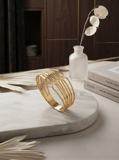 Modern architectural gold cuff bracelet.