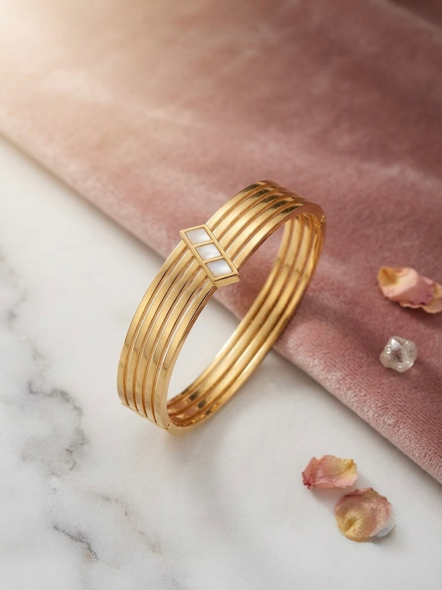 Elegant anti-tarnish multi-band gold bracelet.