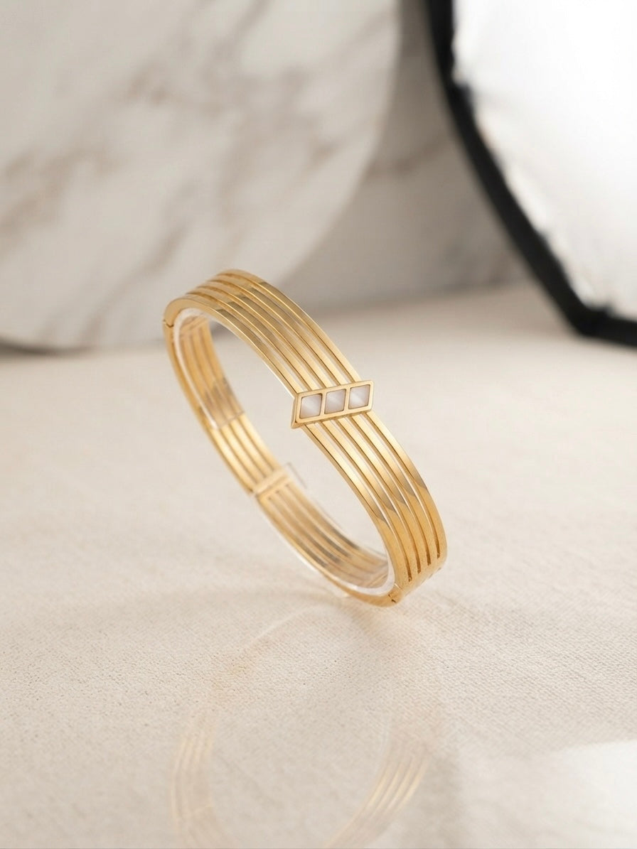 Elegant anti-tarnish multi-band gold bracelet.