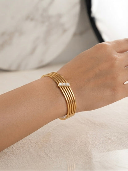 Elegant anti-tarnish multi-band gold bracelet.