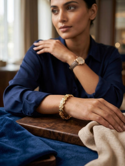 Diamond-accented geometric gold kada bracelet.