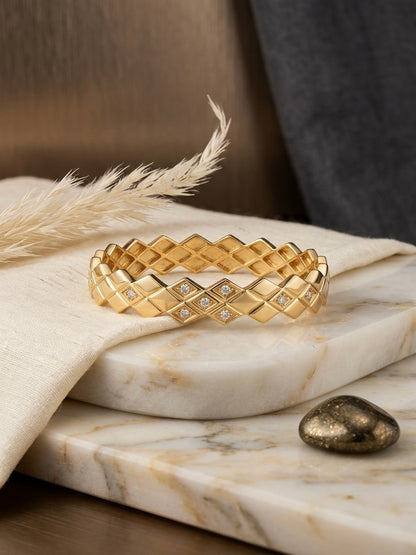 Diamond-accented geometric gold kada bracelet.