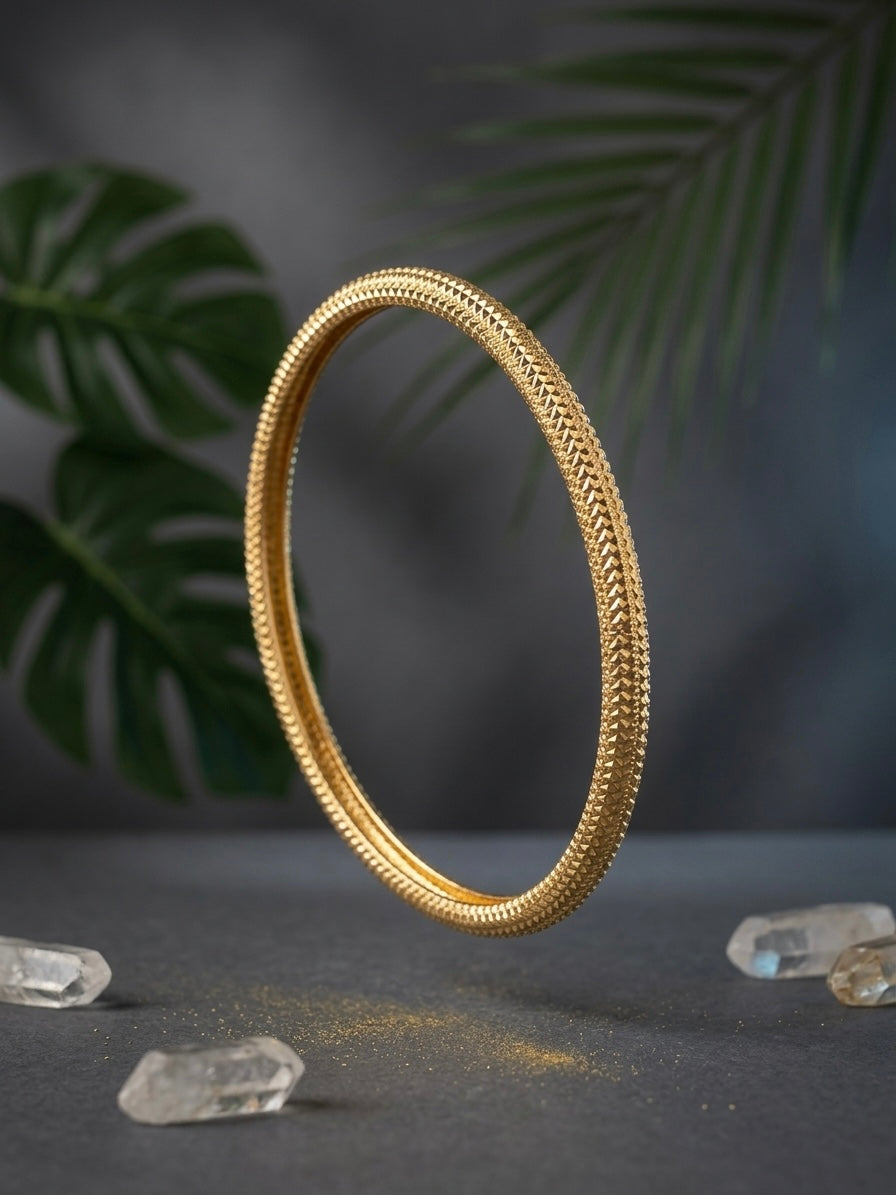 Shimmering geometric pattern gold kada.
