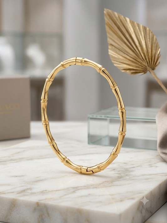 Elegant bamboo-inspired gold kada bracelet.