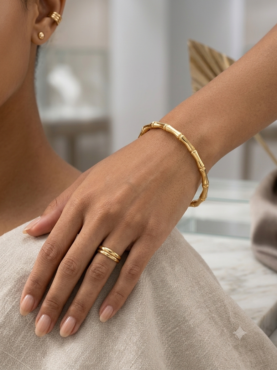 Elegant bamboo-inspired gold kada bracelet.