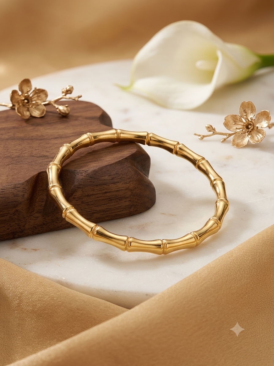 Elegant bamboo-inspired gold kada bracelet.