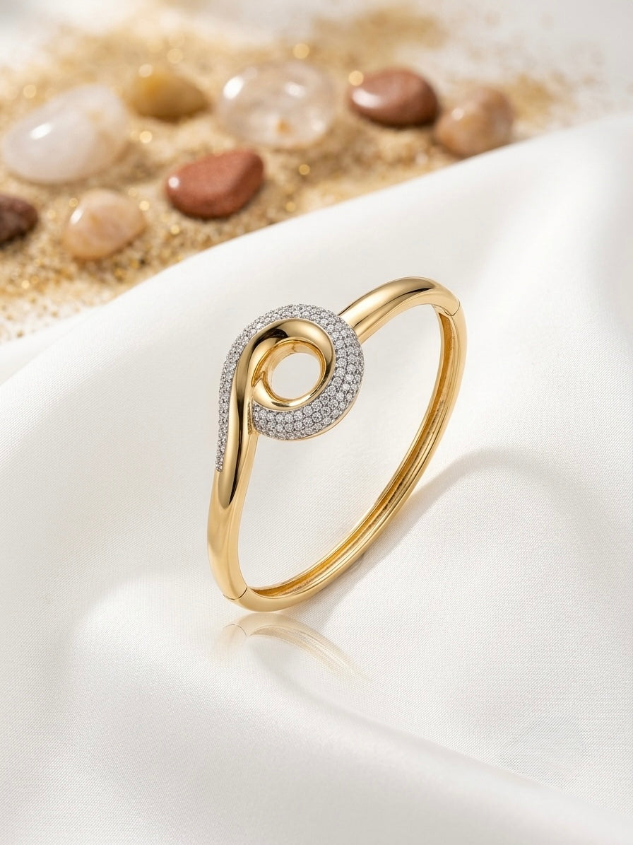 Sparkling twisted swirl gold bracelet.