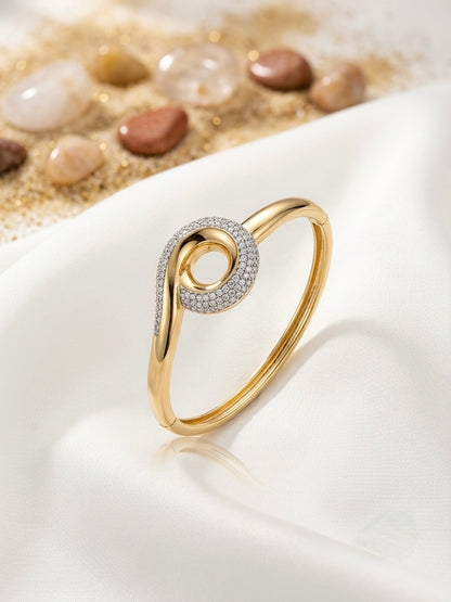 Sparkling twisted swirl gold bracelet.