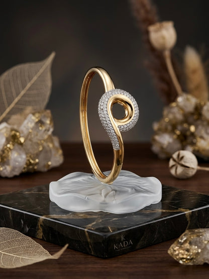 Sparkling twisted swirl gold bracelet.