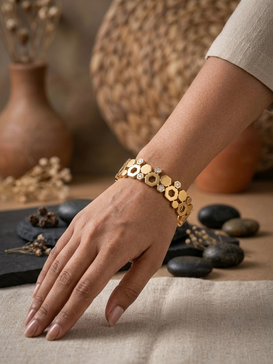 Geometric hexagonal gold statement bracelet.