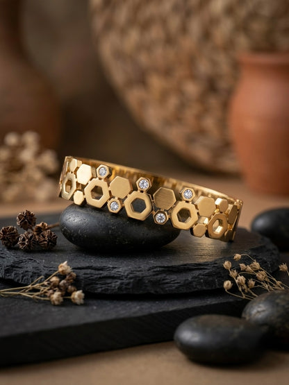 Geometric hexagonal gold statement bracelet.