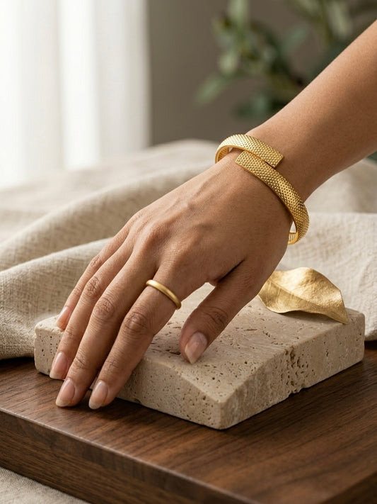 Modern textured overlap gold bracelet.