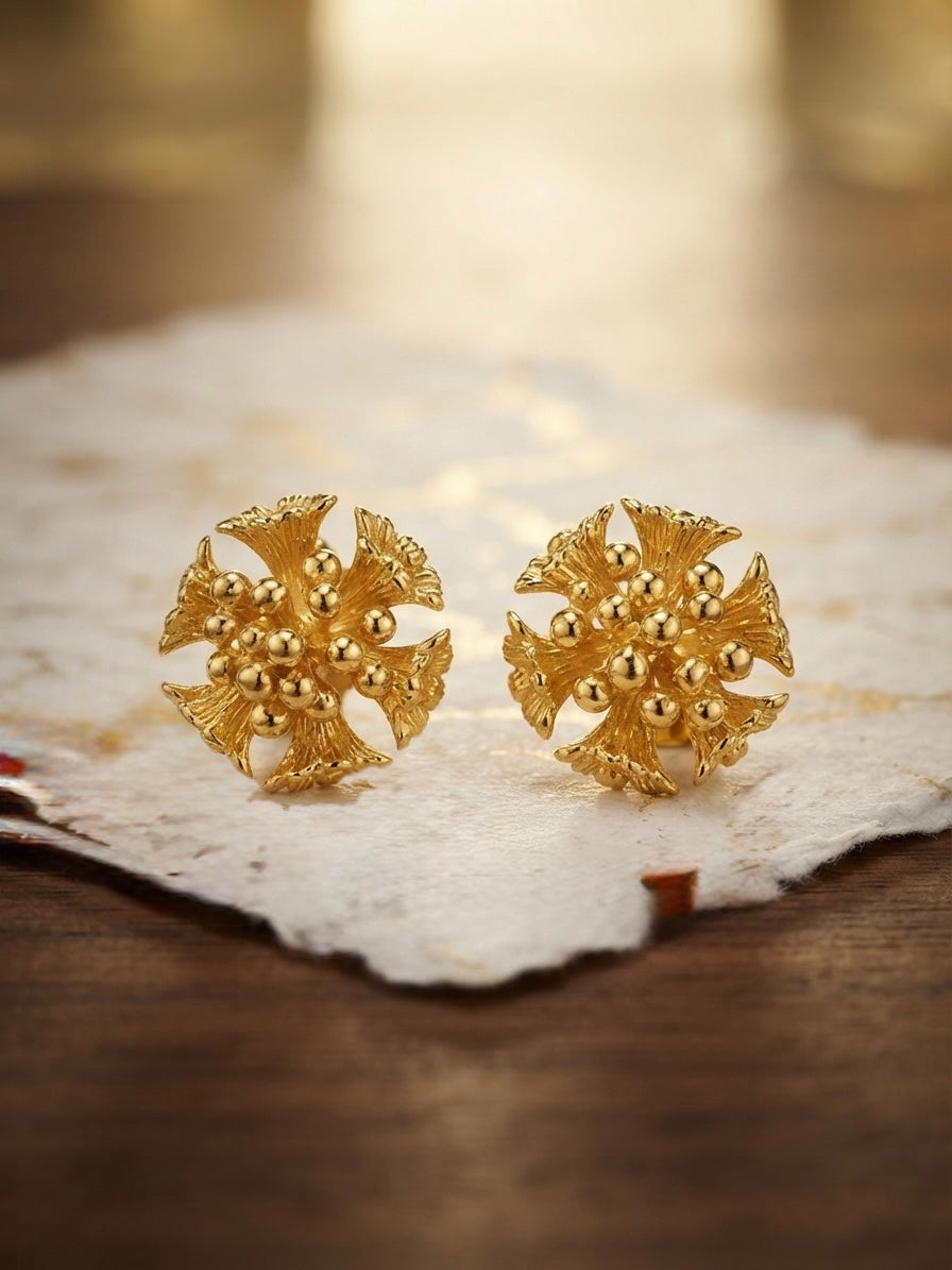 Intricate floral cluster gold stud earrings.