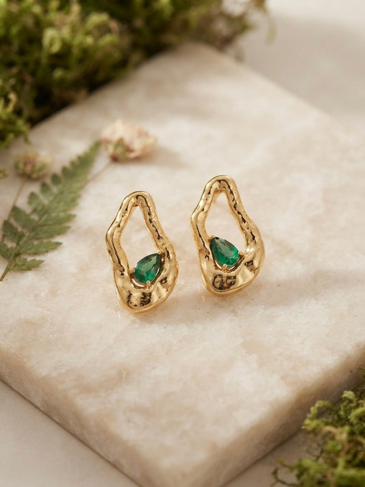 Organic molten gold emerald drop earrings.