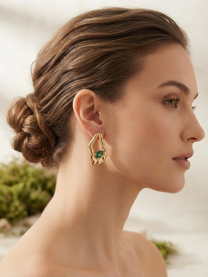 Organic molten gold emerald drop earrings.