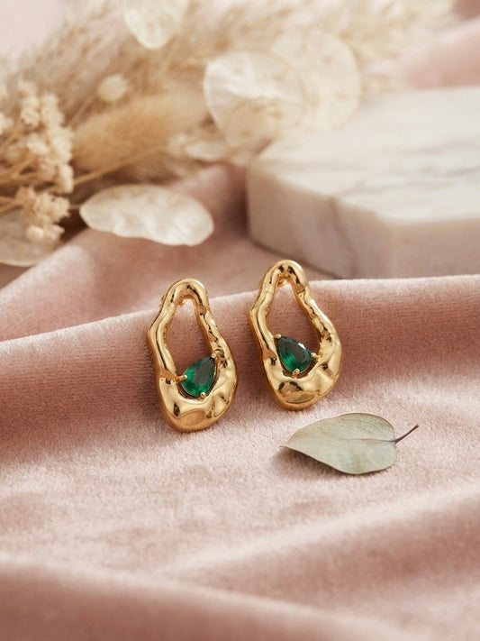Organic molten gold emerald drop earrings.