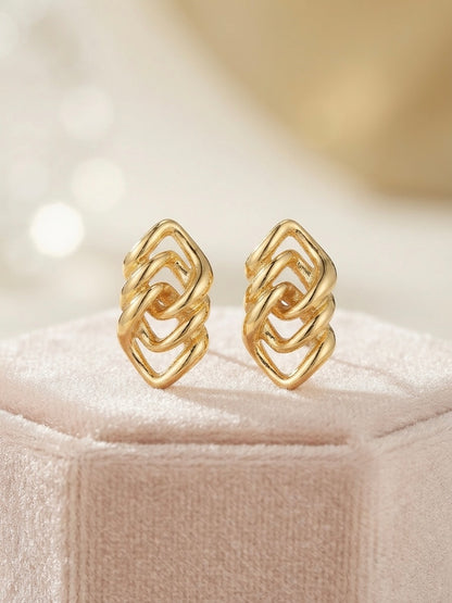 Geometric interlocking gold lozenge earrings.