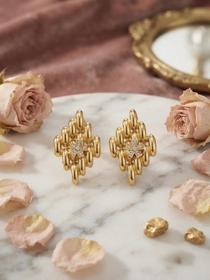 Sculpted geometric gold cluster statement studs.