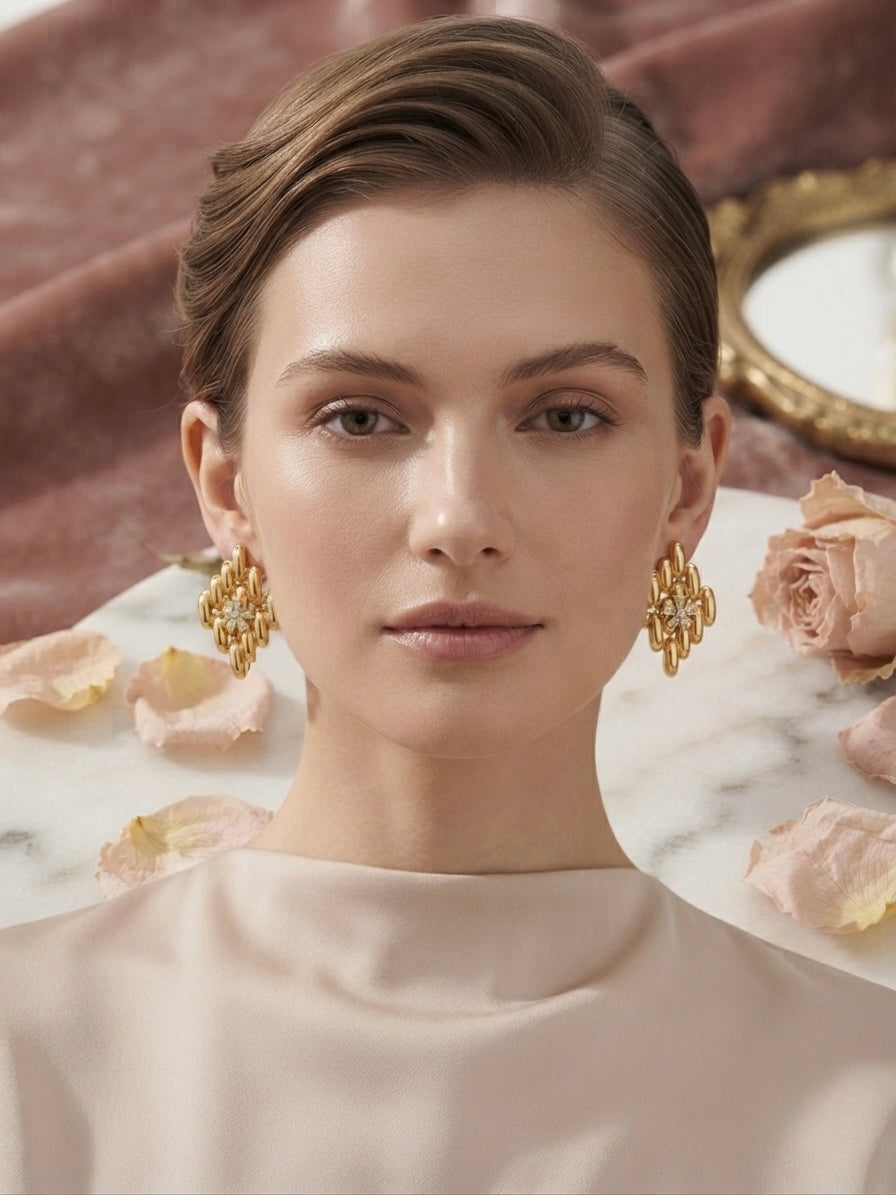 Sculpted geometric gold cluster statement studs.