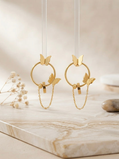 Gold butterfly hoop drop chain earrings.