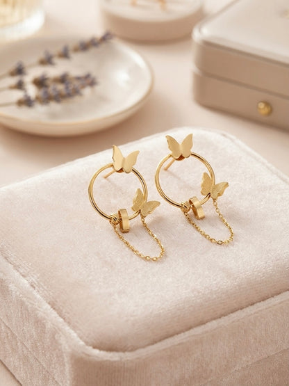 Gold butterfly hoop drop chain earrings.