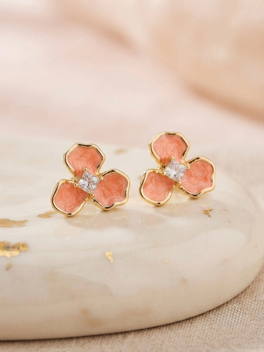 Pink enamel crystal flower stud earrings.