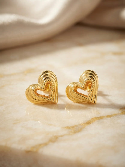 Textured beaded gold heart stud earrings.
