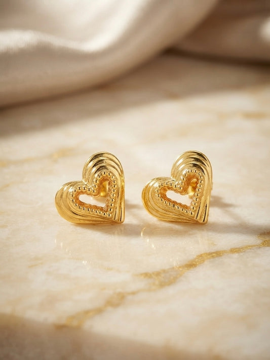 Textured beaded gold heart stud earrings.