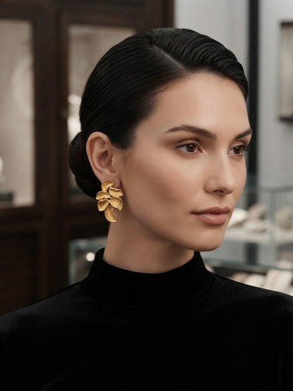 Sculpted botanical leaf statement studs.