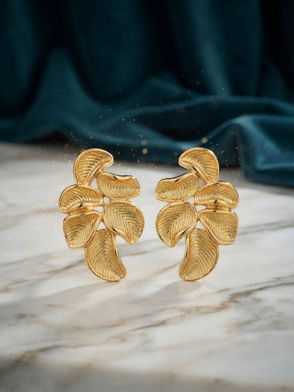 Sculpted botanical leaf statement studs.
