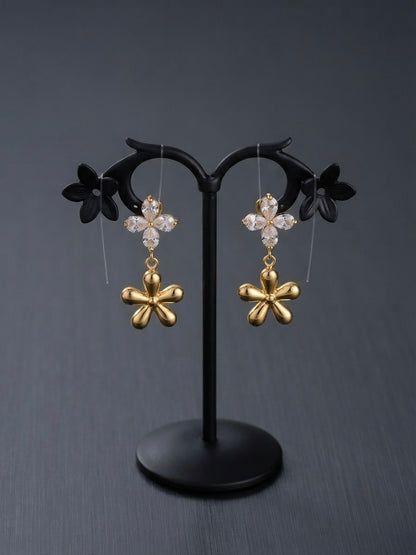 Crystal flower and gold charm earrings.