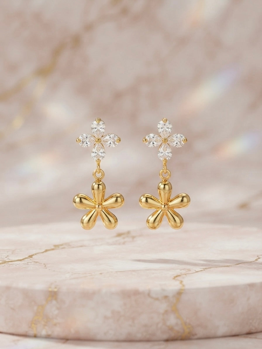Crystal flower and gold charm earrings.