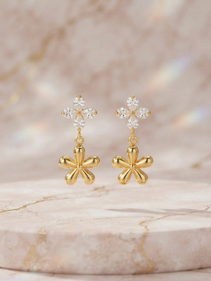 Crystal flower and gold charm earrings.