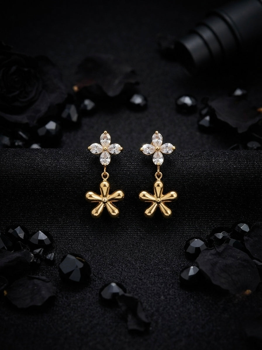 Crystal flower and gold charm earrings.