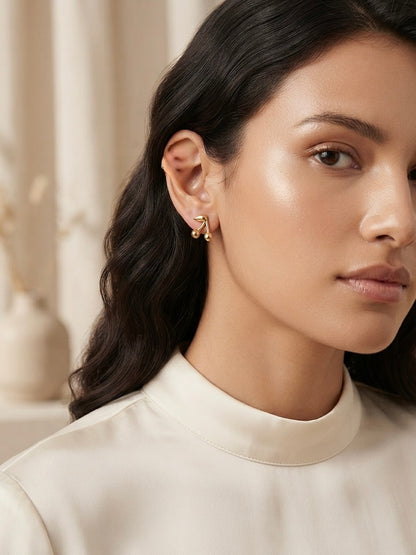 Modern musical symbol gold stud earrings.