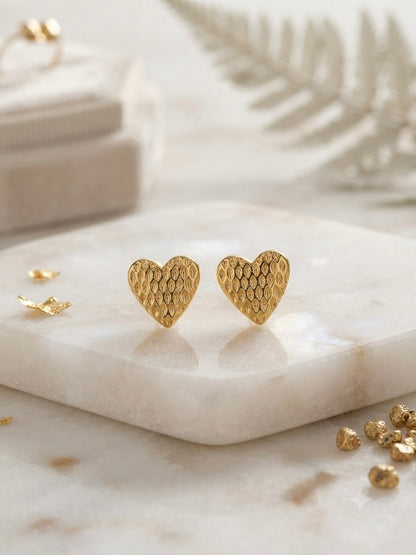 Textured honeycomb pattern gold heart studs.