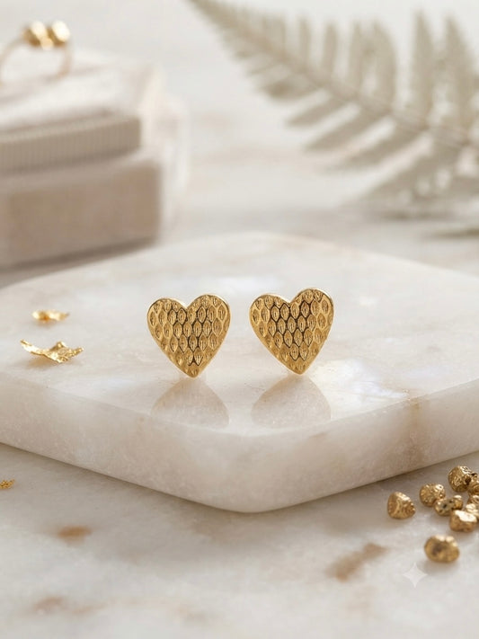 Textured honeycomb pattern gold heart studs.