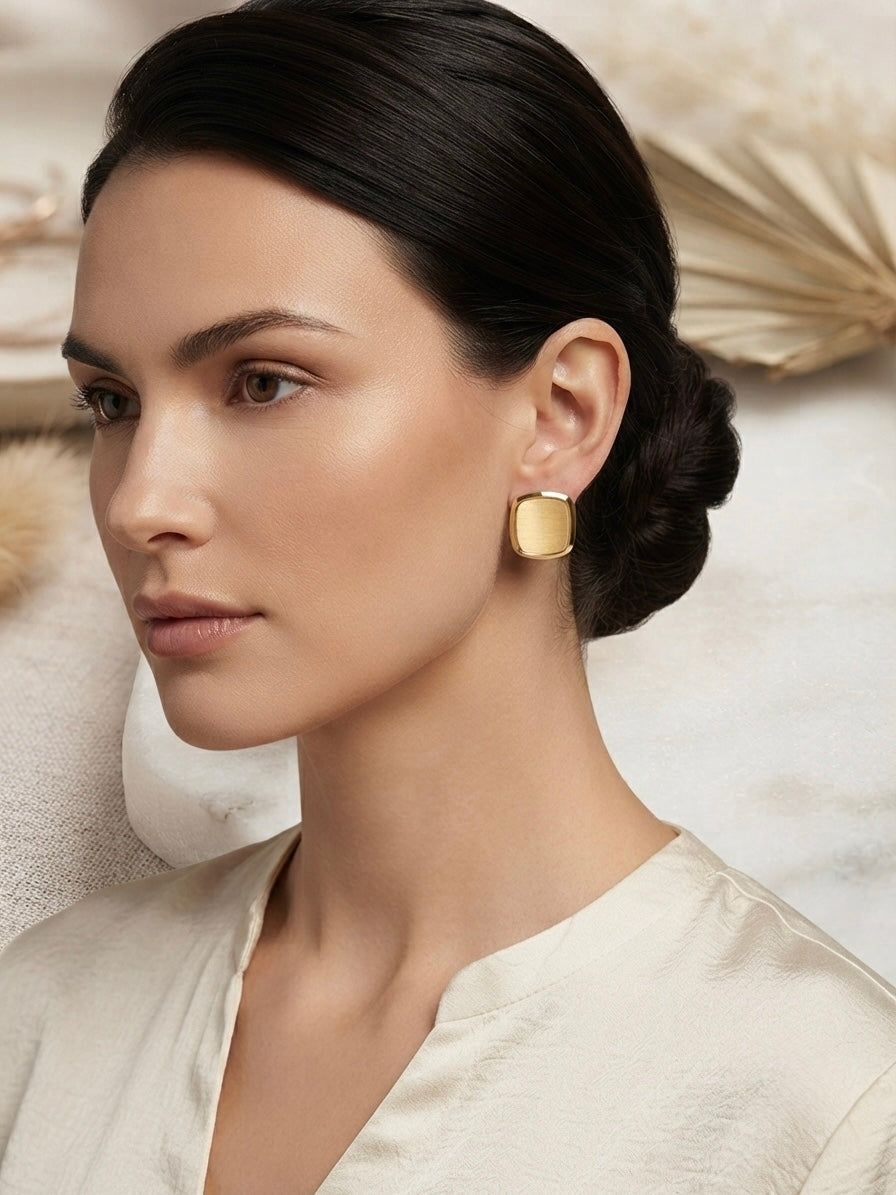 Modern minimalist brushed square studs.