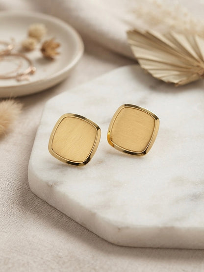 Modern minimalist brushed square studs.