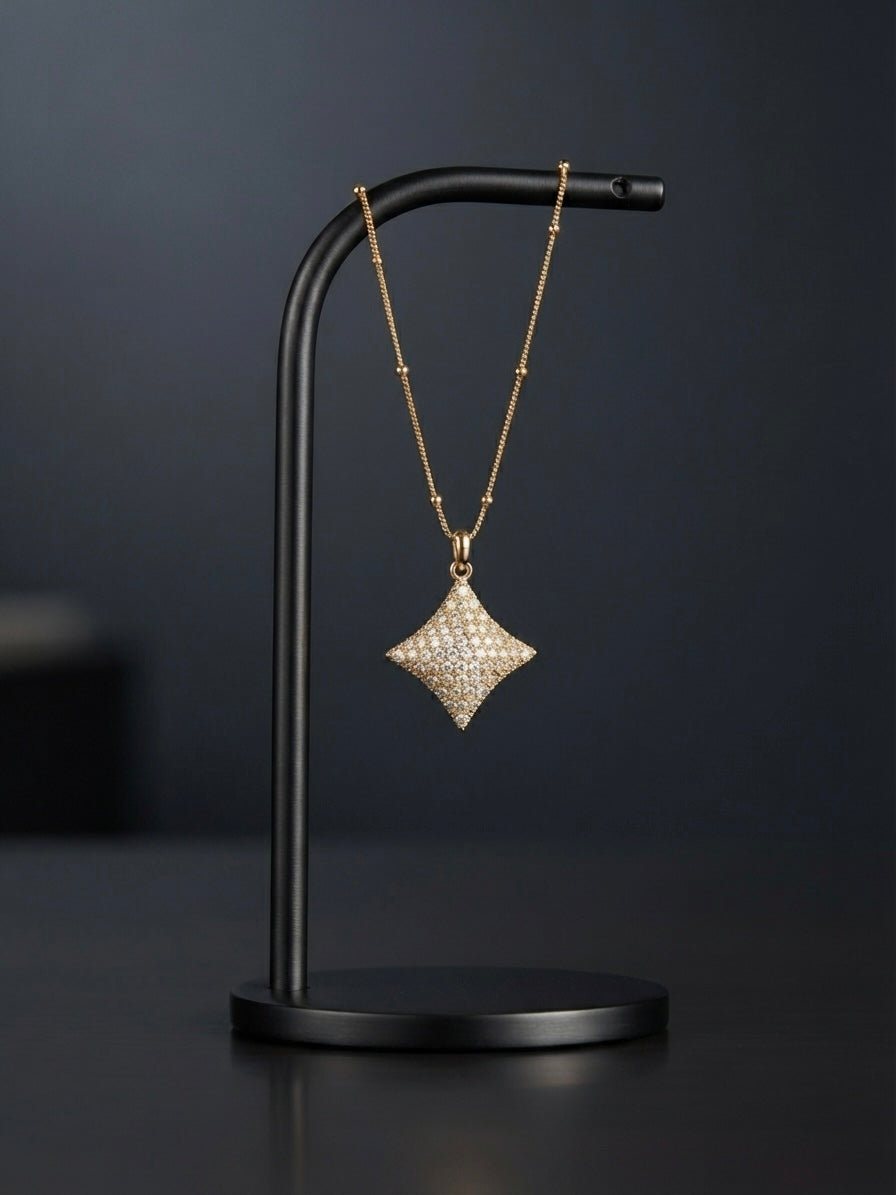 Elegant crystal starburst pendant on chain.