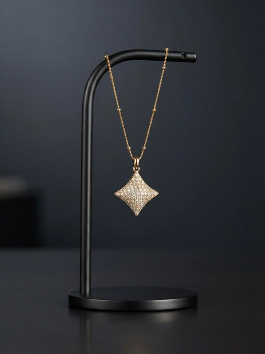 Elegant crystal starburst pendant on chain.