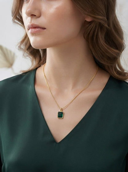 Gold emerald cut green stone necklace set.