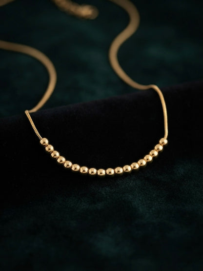 Minimalist gold  chain bead slide necklace.