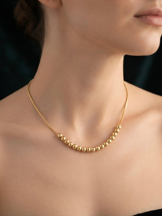 Minimalist gold  chain bead slide necklace.