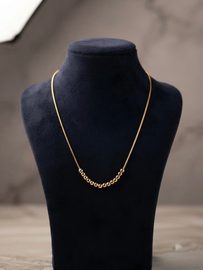 Minimalist gold  chain bead slide necklace.