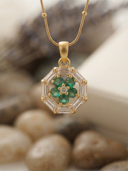 Geometric emerald floral pendant on chain.