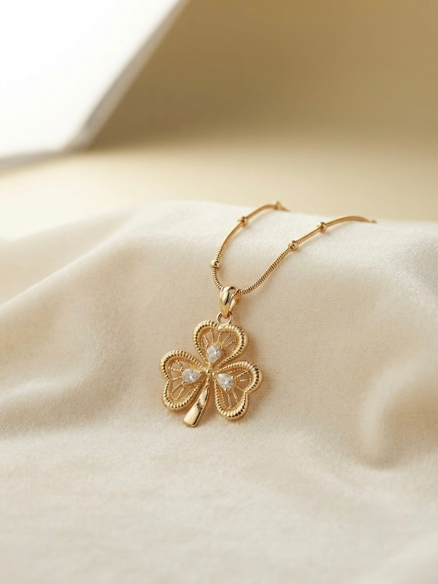 Filigree three leaf clover pendant gold necklace.