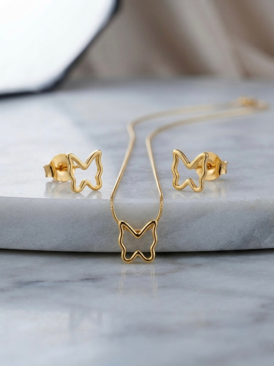 Minimalist hollow butterfly pendant and earring set.