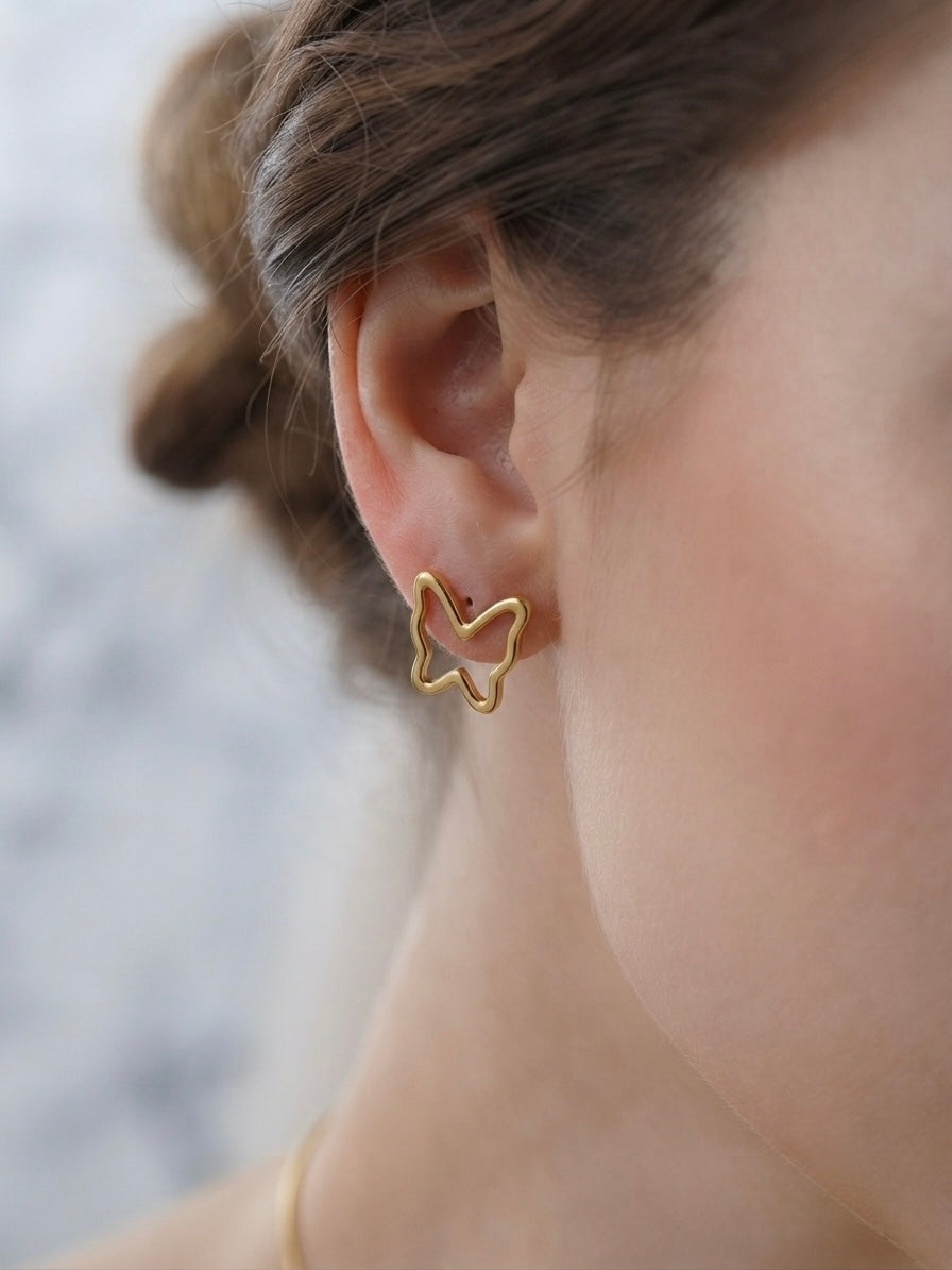 Minimalist hollow butterfly pendant and earring set.