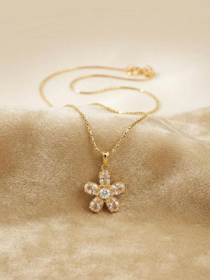 Sparkling gold crystal flower pendant necklace.